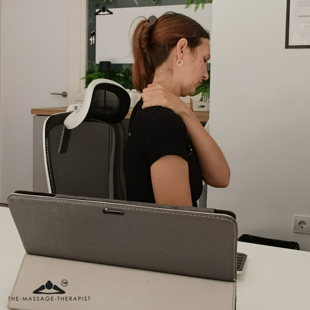 The-Massage-Therapist demonstrating a self-massage technique for shoulder pain.