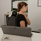 The-Massage-Therapist demonstrating a self-massage technique for shoulder pain.