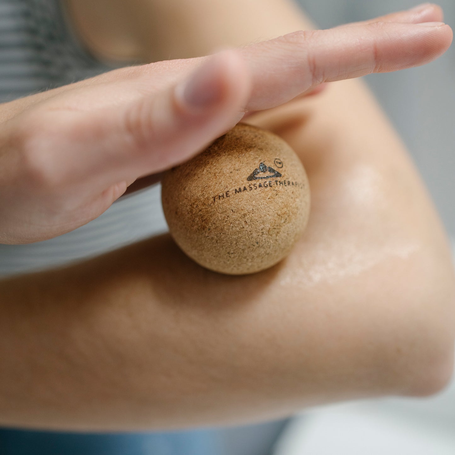 Using the cork massage ball to ease muscle tension in the lower arm